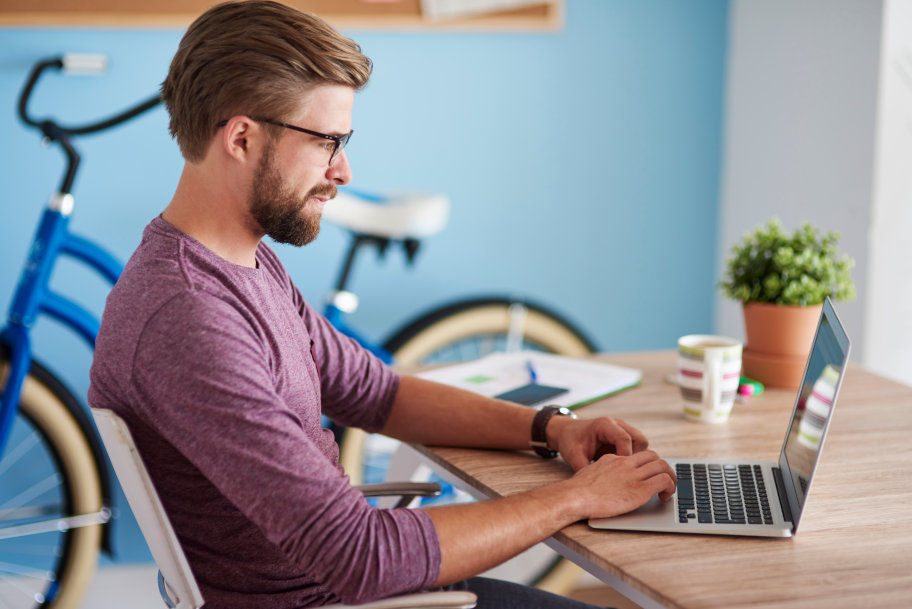 Man working on laptop at home